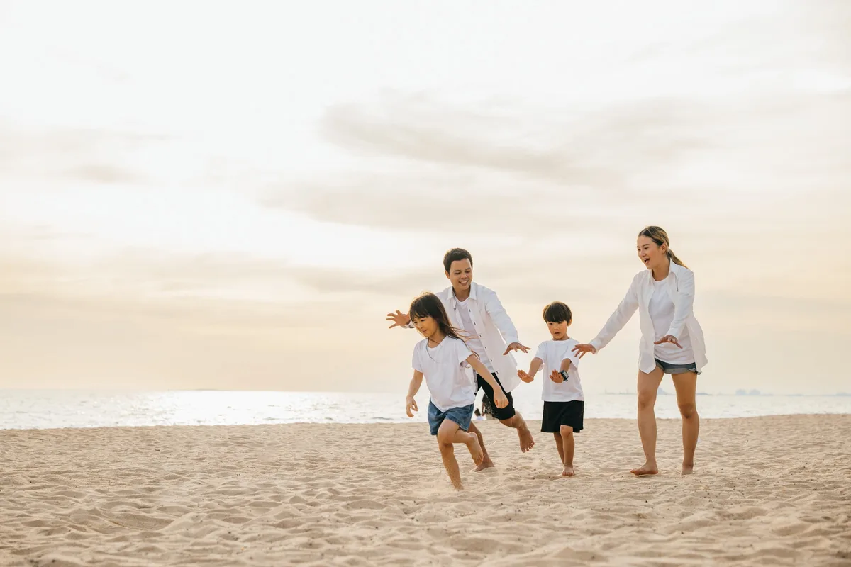 A family on the beach at Hastings Point, near the Wellness Hub